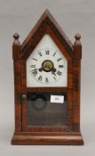 A 19th century rosewood mantle clock. 39.5 cm high.