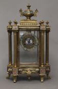 A brass and cloisonne mounted clock. 62 cm high.
