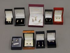 A quantity of 9 ct gold earrings.