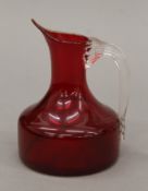 A Whitefriars red and clear glass jug. 12 cm high.