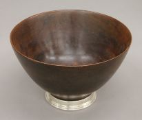 A large silver mounted turned wooden bowl. 31 cm diameter.