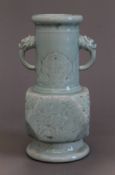 A Chinese twin handled celadon vase. 29.5 cm high.