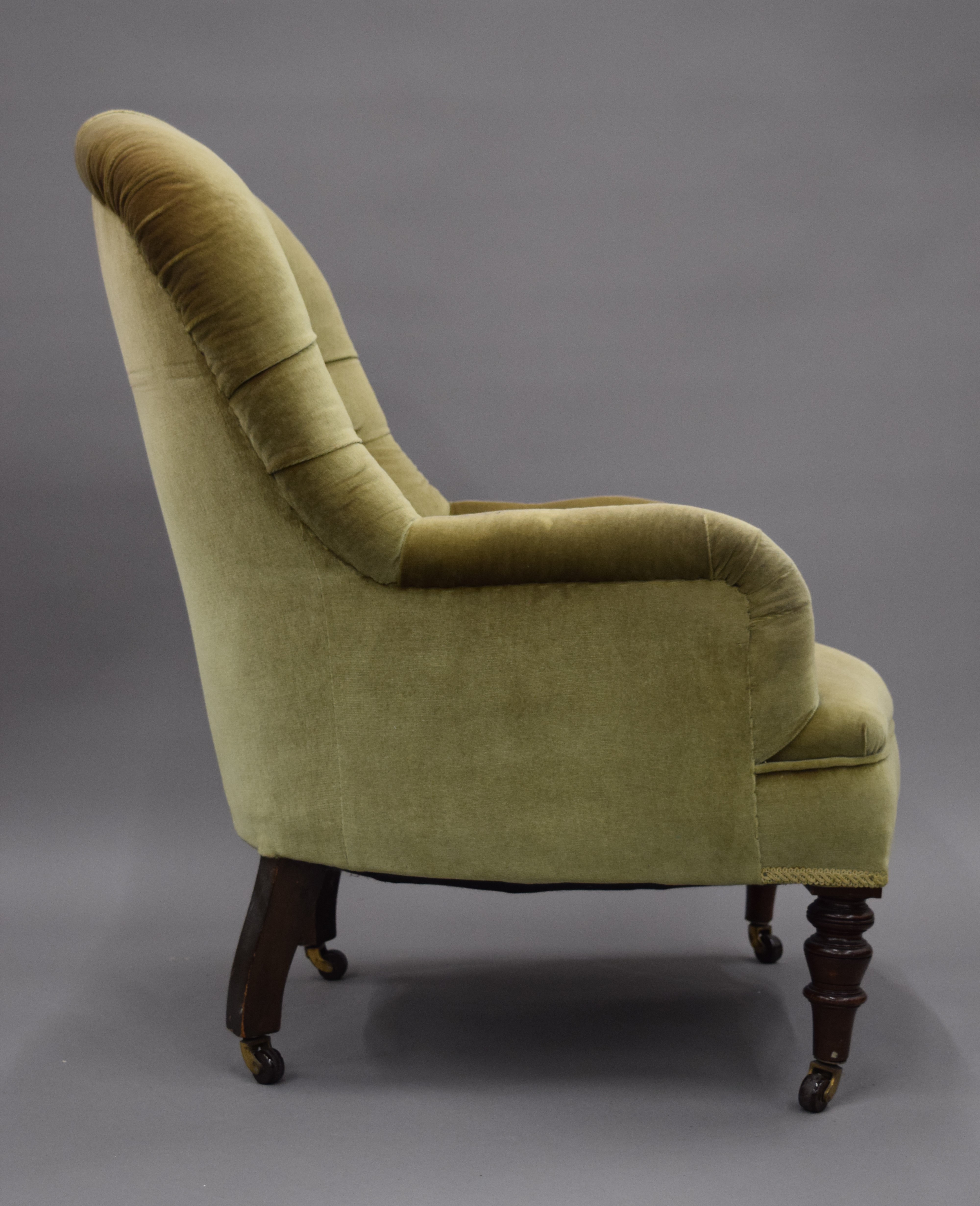 A Victorian upholstered button back arm chair. 65 cm wide. - Image 6 of 7