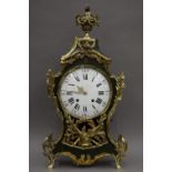 A 19th century French brass mounted green painted wooden mantle clock. 79 cm high.