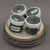 Six porcelain plates and four Poole pottery herb storage pots. The pots 7.5 cm high.