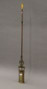 A brass longcase pendulum. 109 cm long.