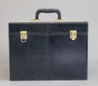 A leather vanity case. 36 cm wide.