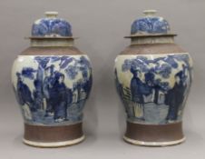 A pair of Chinese blue and white porcelain lidded vases. Approximately 48 cm high.