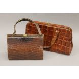 Two crocodile skin handbags. The largest 34 cm wide.