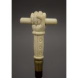 A walking stick with a carved bone handle formed as a hand. 93 cm long.