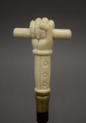 A walking stick with a carved bone handle formed as a hand. 93 cm long.