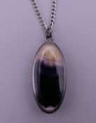 A silver and Blue John pendant on chain. The pendant 3.25 cm high.