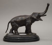 A bronze model of an elephant. 20 cm high.