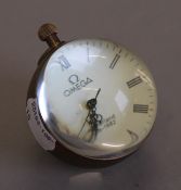 A small ball clock. 6 cm high.