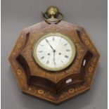 A 19th century inlaid rosewood wall clock. 41 cm wide.