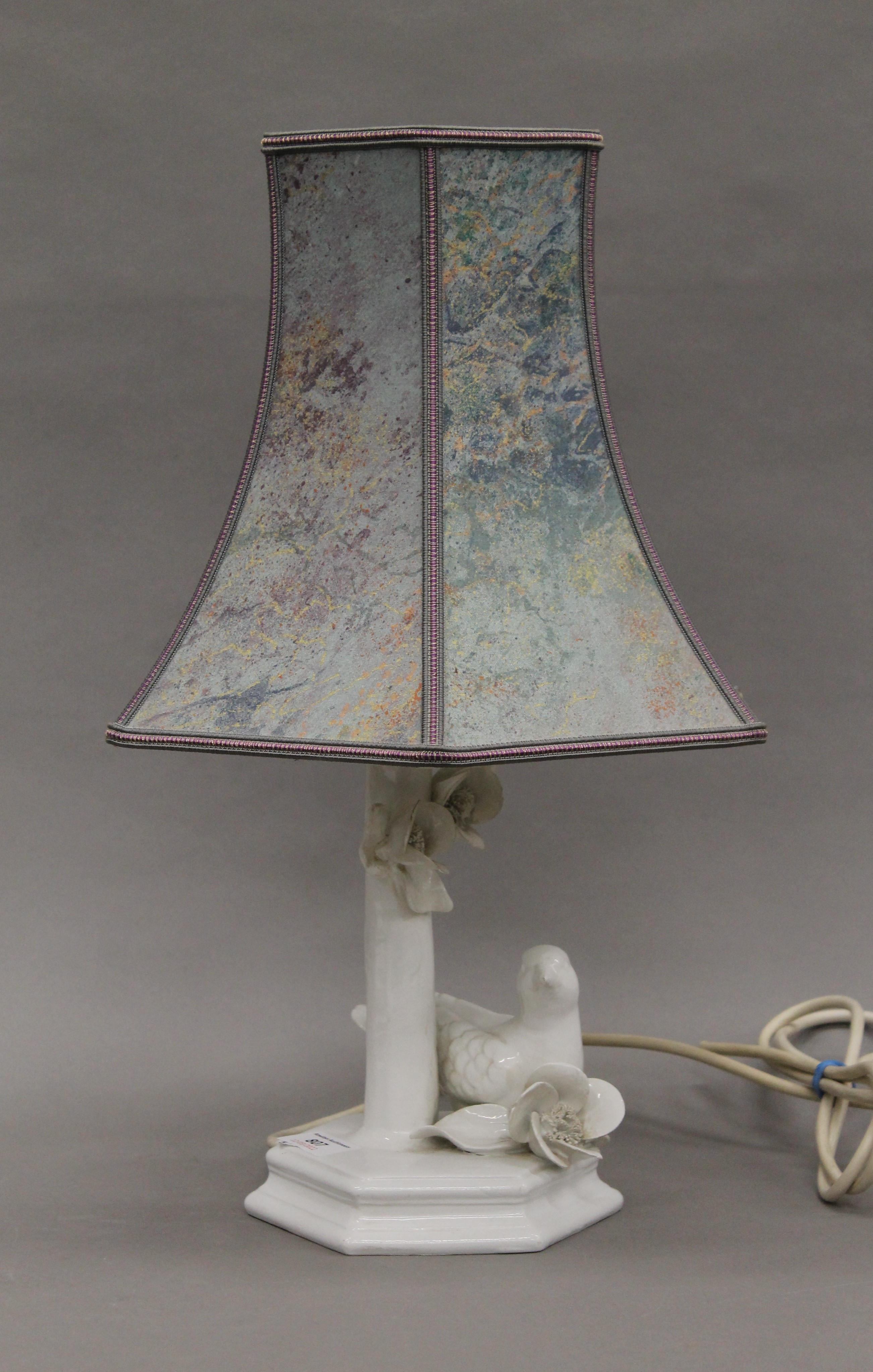 A porcelain table lamp. 44 cm high overall.