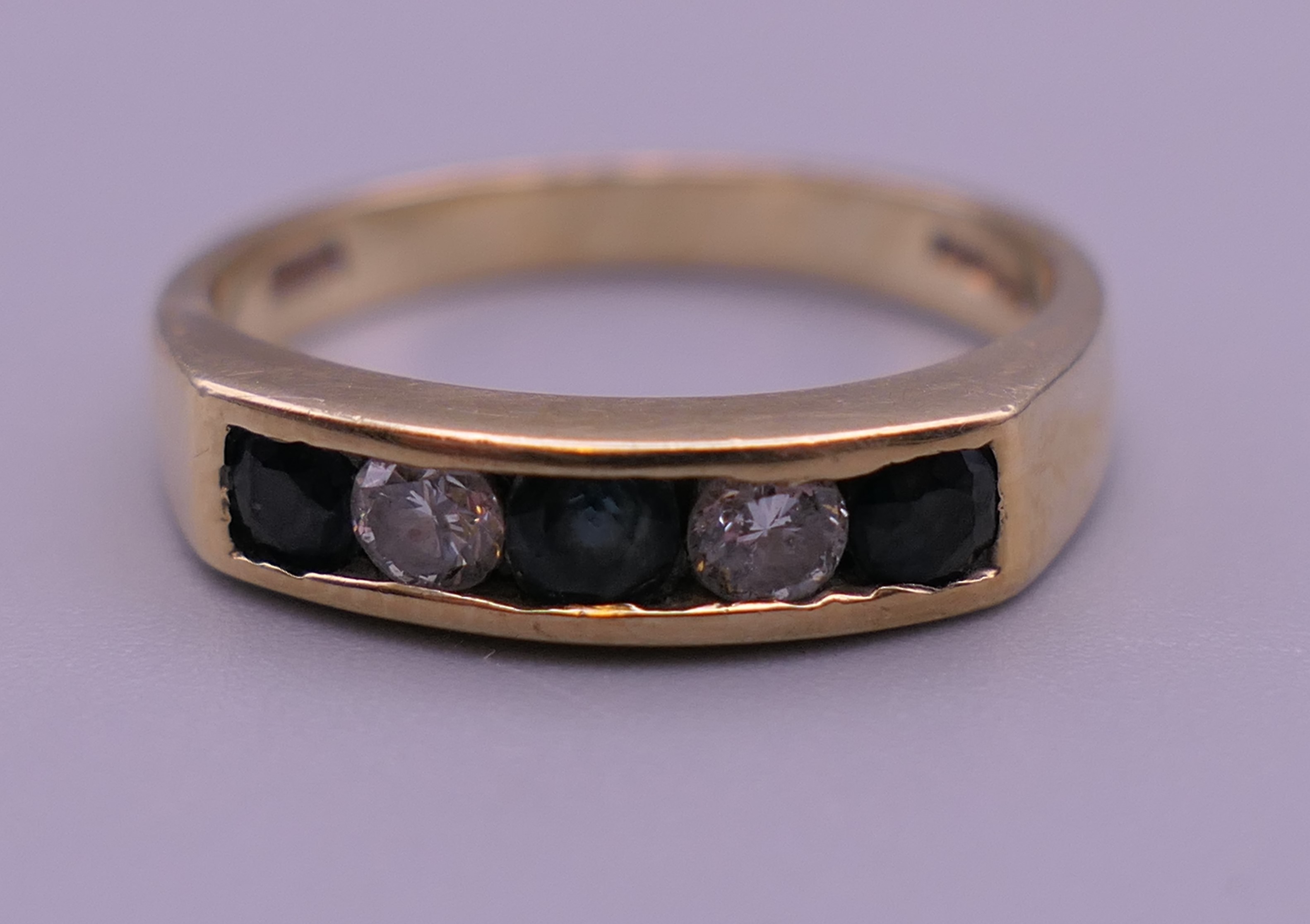 A 9 ct gold diamond and sapphire ring. Ring size N. 2.9 grammes total weight. - Image 7 of 7