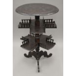 A 19th century carved oak three-tiered tripod table. 57 cm diameter.