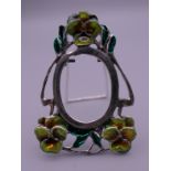 A miniature silver Art Nouveau style photograph frame. 4.5 cm high.