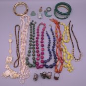A quantity of Oriental jewellery, including jade beads, etc.