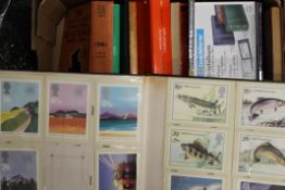 A large collection of stamps and related books.