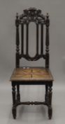 A 19th century carved oak side chair. 43.5 cm wide.