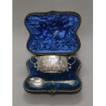A cased silver Christening bowl and an associated spoon. The bowl 14 cm wide. 150 grammes.