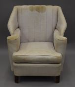 A Victorian upholstered arm chair. 74 cm wide.