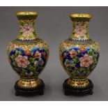 A pair of cloisonne vases on stands. 28 cm high overall.