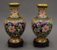 A pair of cloisonne vases on stands. 28 cm high overall.