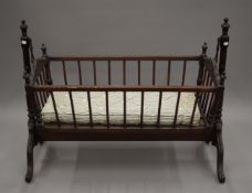 A vintage child's cot. 106.5 cm long.