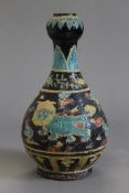 A Chinese black and light blue pottery garlic neck vase. 36 cm high.