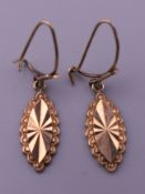 A pair of 9 ct gold drop earrings. 1.7 grammes total weight.