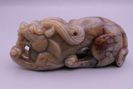 A Chinese jade dog-of-fo. 10.5 cm long.