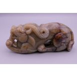 A Chinese jade dog-of-fo. 10.5 cm long.