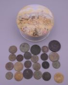 A collection of early coins and tokens in a Victorian Prattware pot and lid decorated with a