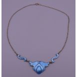 A silver blue enamel pendant on chain. The pendant 2 cm high.