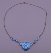 A silver blue enamel pendant on chain. The pendant 2 cm high.