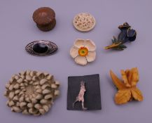 A quantity of brooches, etc.
