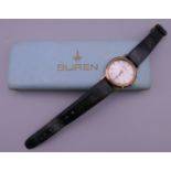 A 9 ct gold cased gentlemen's Buren wristwatch. 3.25 cm wide. 39 grammes total weight.