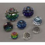 A collection of Swarovski crystal paperweights.