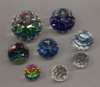 A collection of Swarovski crystal paperweights.