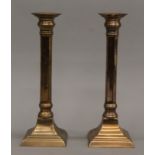 A pair of 18th/19th century gun metal candlesticks. 25.5 cm high.