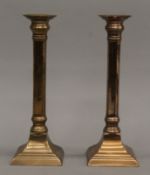 A pair of 18th/19th century gun metal candlesticks. 25.5 cm high.