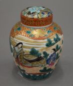 A 19th century Japanese hand painted lidded jar with six character mark to base. 10 cm high.