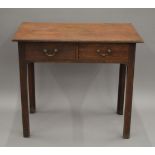 A 19th century oak two-drawer side table. 80.5 cm wide.