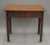 A 19th century oak two-drawer side table. 80.5 cm wide.