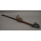 A Victorian dress sword in leather scabbard. 98 cm long.