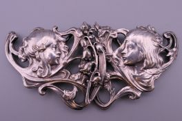 An Art Nouveau silver plated belt buckle. 11 cm wide.