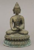 A bronze model of Buddha. 14 cm high.